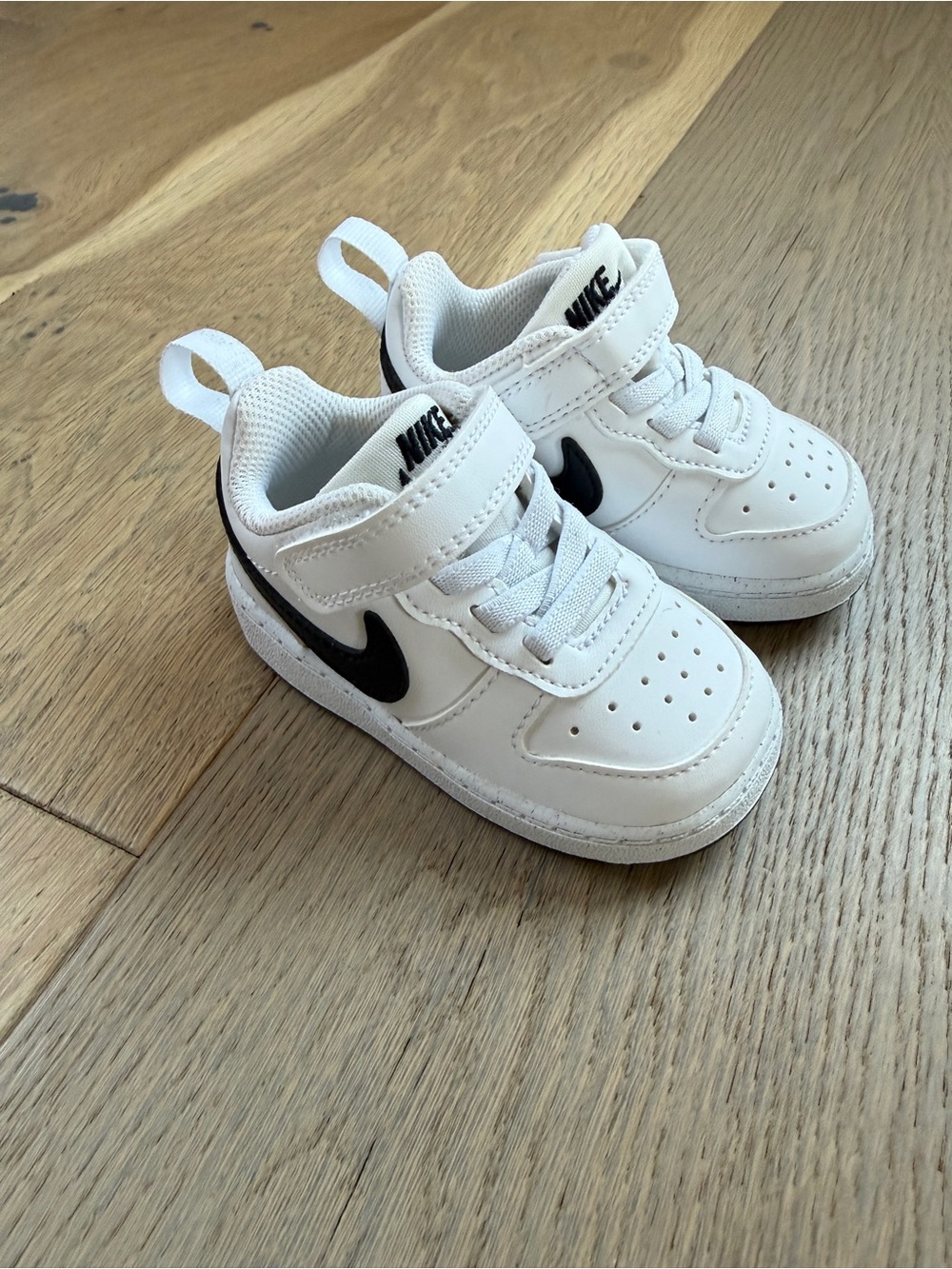 Nike White Sneakers with Black Swoosh - Kids